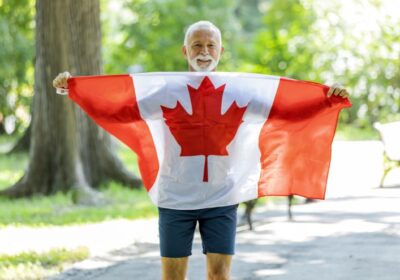 Senior-man-holding-Canadian-flag