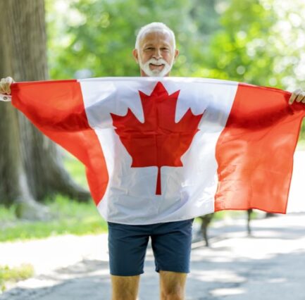 Senior-man-holding-Canadian-flag